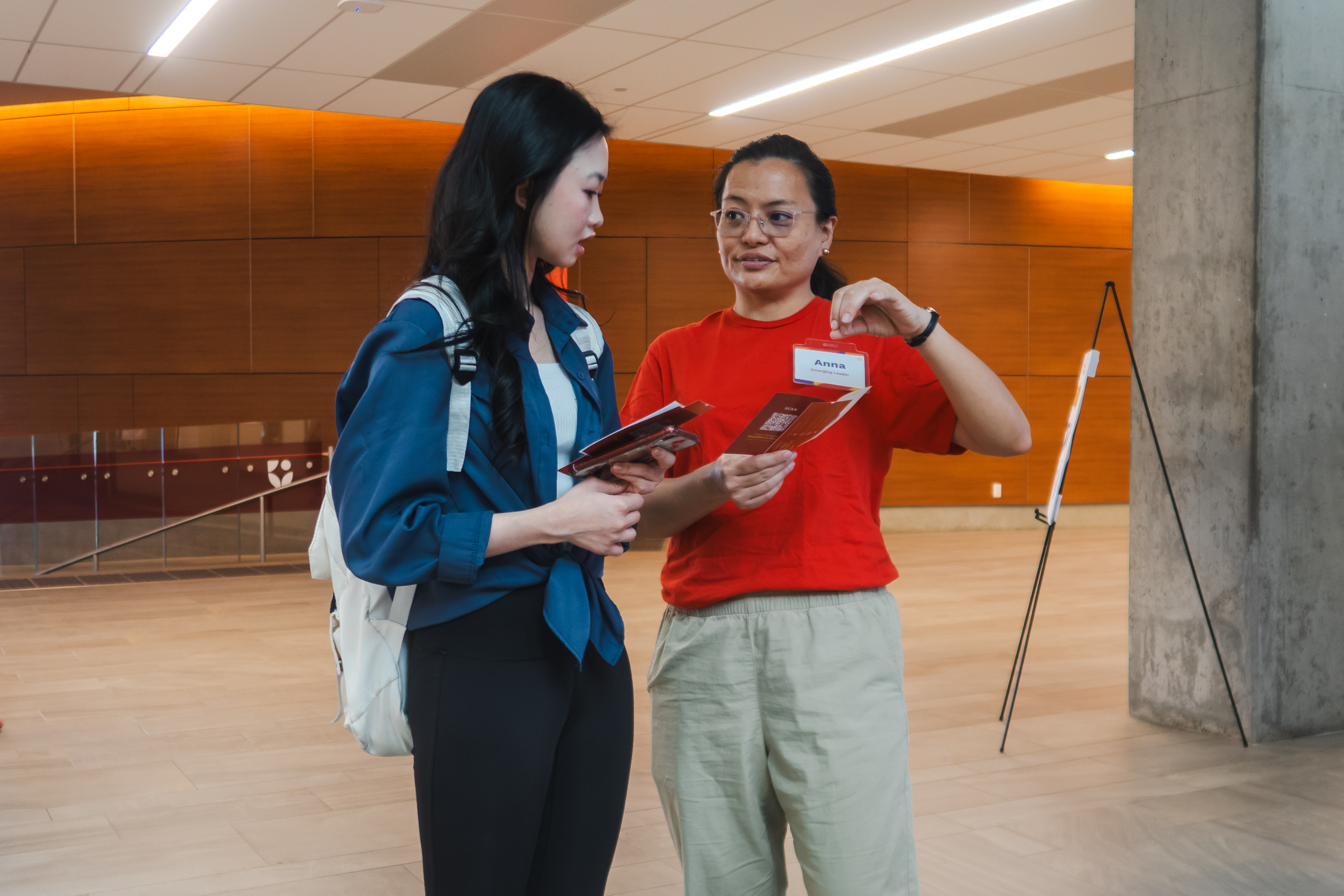 A student helping another student with directions