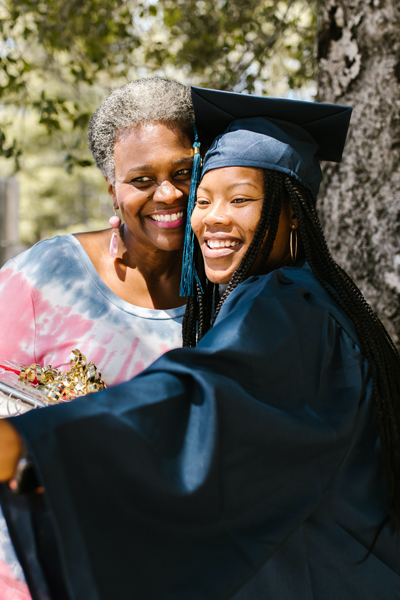 A student and elderly women celebrating graduation