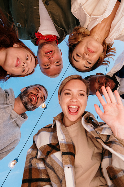 A group of people taking a selfie from below