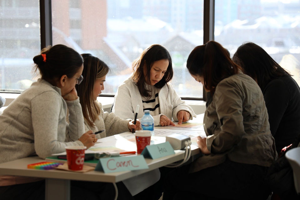 A group of students working on a table