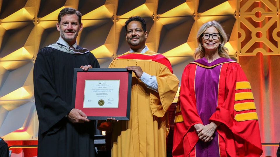 Kristian Bainey receiving his honorary diploma