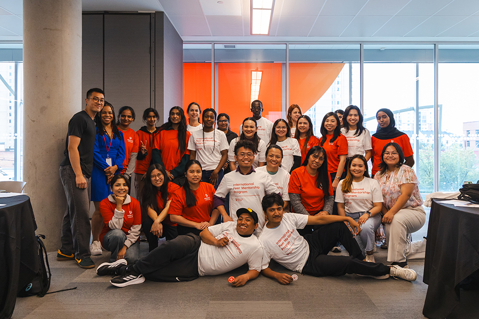 A group of international students posing for a group photo