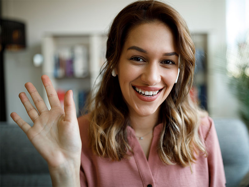 A women raising her hand asking a question