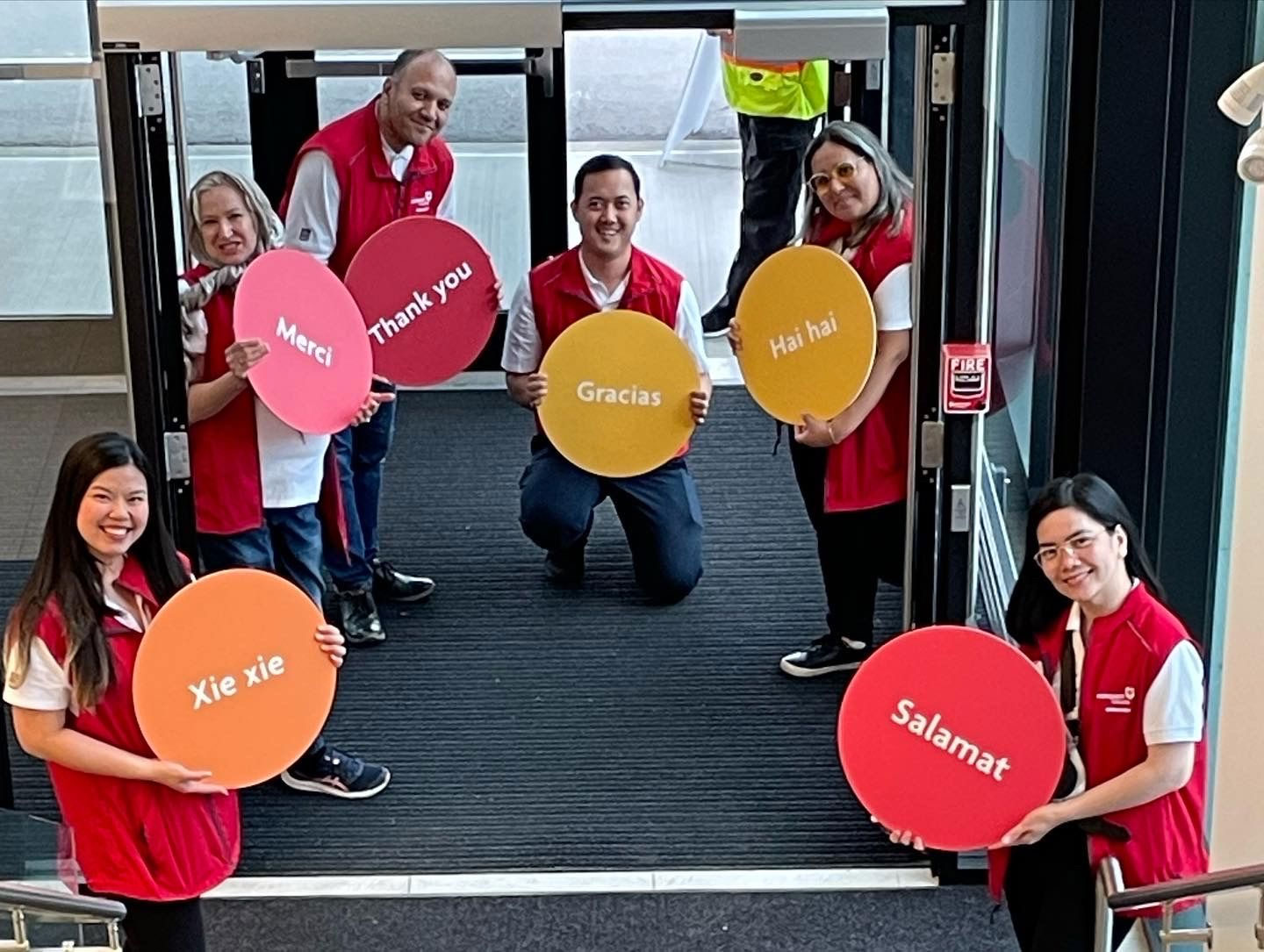RBC Ambassadors holding signs that say thank you in different languages